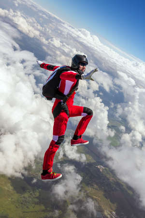 Two sports parachutist build a figure in free fall. Extreme sport concept.の写真素材