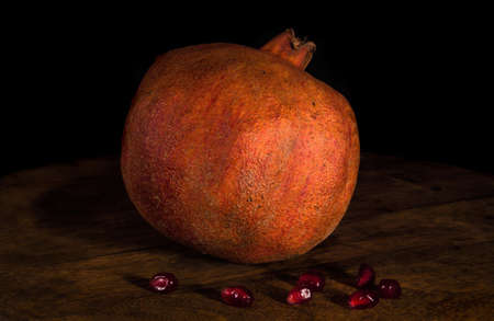 Pomegranate fruits. Still life on a black background.の写真素材