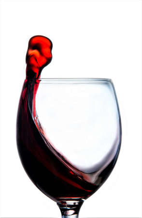 On a white background a glass with red wine.の写真素材