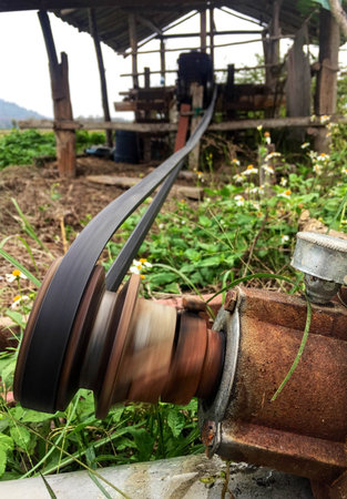 closeup the Long and old conveyor belt is running.の写真素材