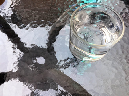 Drinking water and ice in glass on the tableの写真素材