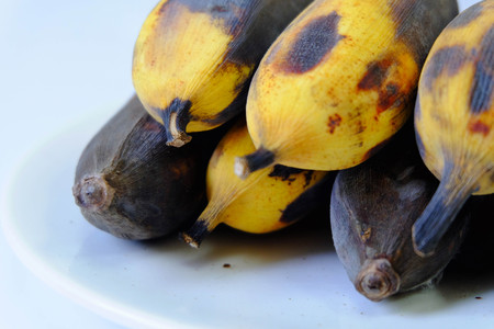 Rotten banana mold Isolated in a white dish on white background.の写真素材