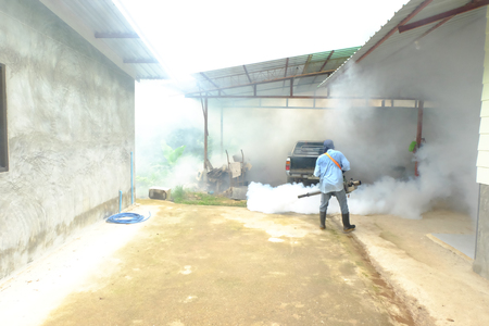 Chiang rai, Thailand - June 10, 2018: Spray mosquito repellent , Man work fogging to eliminate mosquitoes that cause Dengue hemorrhagic fever (DHF) in the coming rainy season.のeditorial素材