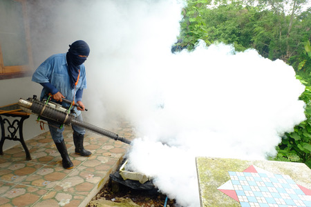 Chiang rai, Thailand - June 10, 2018: Spray mosquito repellent , Man work fogging to eliminate mosquitoes that cause Dengue hemorrhagic fever (DHF) in the coming rainy season.のeditorial素材