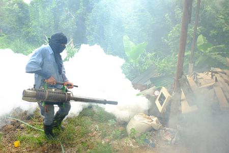 Chiang rai, Thailand - June 10, 2018: Spray mosquito repellent , Man work fogging to eliminate mosquitoes that cause Dengue hemorrhagic fever (DHF) in the coming rainy season.のeditorial素材