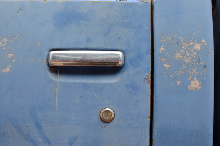 Multicolored background,Rusty metal with blue paint flaking and cracking textureの写真素材