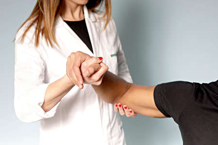 Physiotherapist working with patientの写真素材