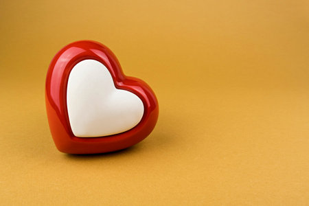 Red heart on yellow backgroundの写真素材