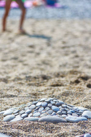 hill of rocks on the shoreの写真素材