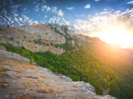 mountain range in the background a sunrise. natural compositionの写真素材