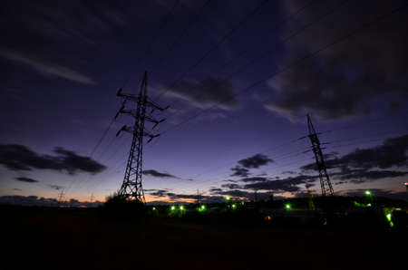 High voltage electric line in sunsetの写真素材