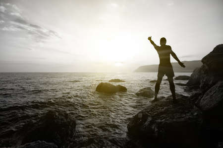 people on the beach at sunset. marine composition. dramatic sceneの写真素材