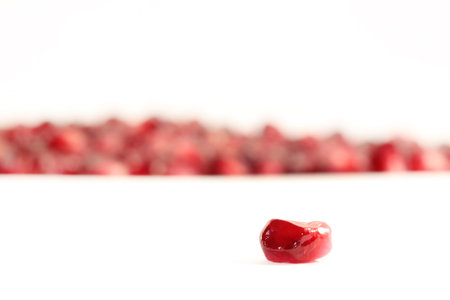 berries are juicy pomegranate imposed slide and a berry in the foreground in focus. composition of...