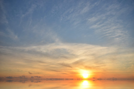 Expanse of the sea against the sunset sky. Beautiful seascape. Natural composition.