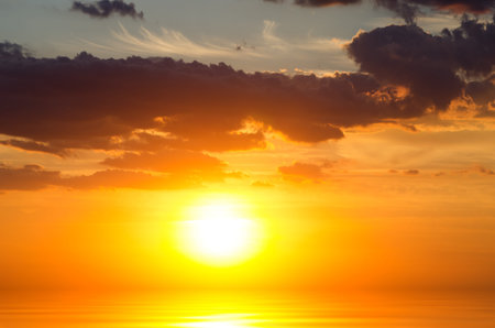 Expanse of the sea against the sunset sky. Beautiful seascape. Natural composition.