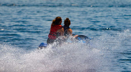 Two people jet-skiing on the St. Lawrence River in the Summerの写真素材