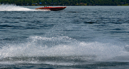 Racing speedboat with splash in foreground