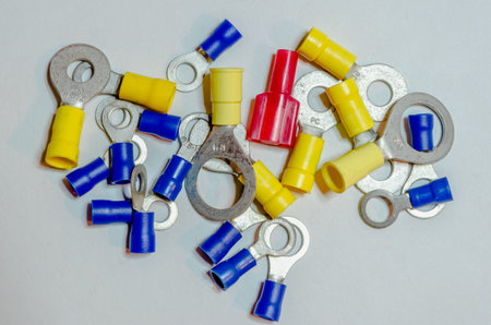 colored assorted wire crimp connectors in a scattered grouping on a white background