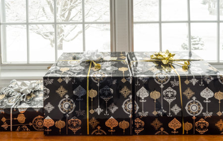 Wrapped Christmas present on a cedar chest in front of window with a snowstorm in the background