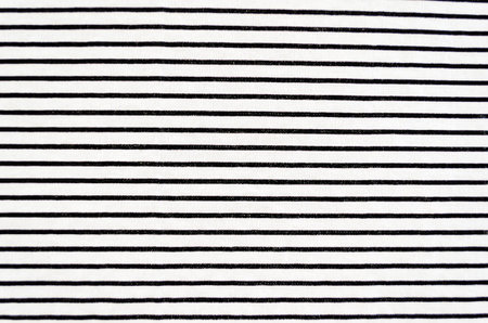 Close-up of fabric with vertical black stripes filling the frame for an abstract background