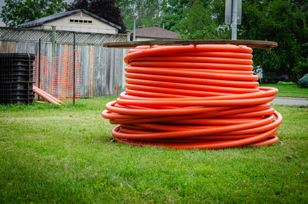 Close view of fiber optic cable construction site in a residential neighborhood