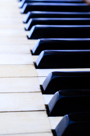 Antique black and white piano keys receedingの写真素材