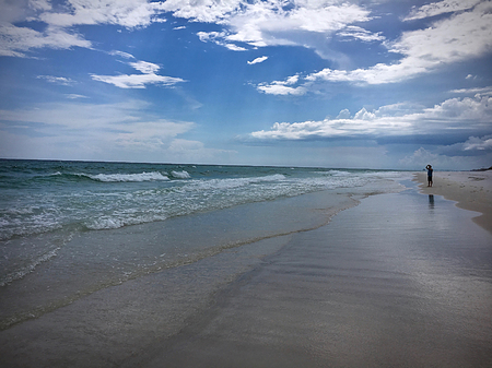 Sandy beach with cloudy skiesの写真素材