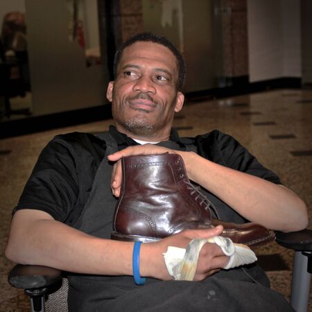 Man shines and proudly display shoeのeditorial素材