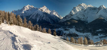 The beautiful panorama of the Sesvenna mountain group in winter, Engadine, Switzerlandの写真素材