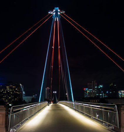 The Holbeinsteg bridge with attractive Illumination in Frankfurt, Germanyの写真素材