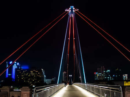 The Holbeinsteg bridge with attractive Illumination in Frankfurt, Germanyの写真素材