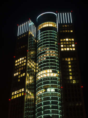 Illuminated skyscrapers in the center of Frankfurt, Germany, at nightの写真素材