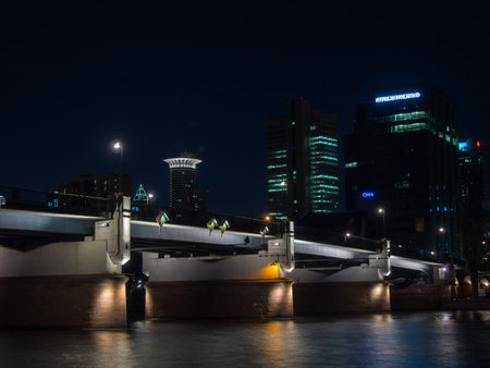 Office buildings and bridge in Frankfurt, Germany, at nightの写真素材