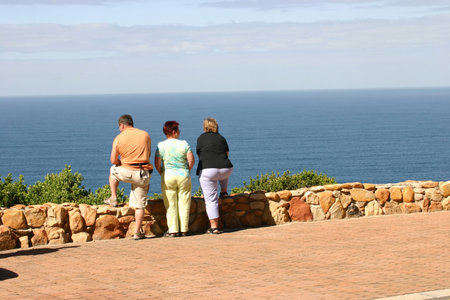 Torists looking out over seaの写真素材