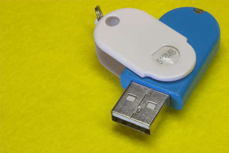 Memory disk on yellow backgroundの写真素材
