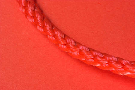 Red rope macro on red backgroundの写真素材