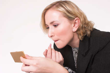 Model putting on makeupの写真素材