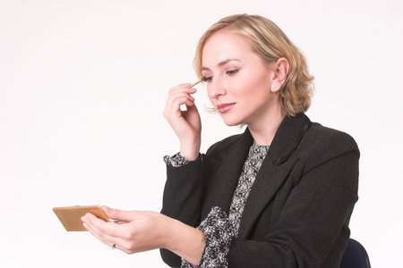 Model putting on eye linerの写真素材