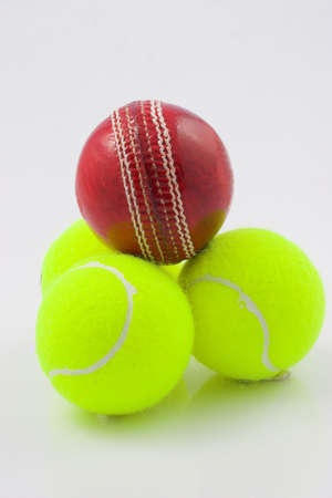 Cricket and tennis balls stackedの写真素材