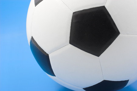 Soccer ball on blue backgroundの写真素材