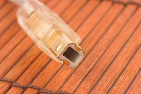 Golden USB port on brown backgroundの写真素材