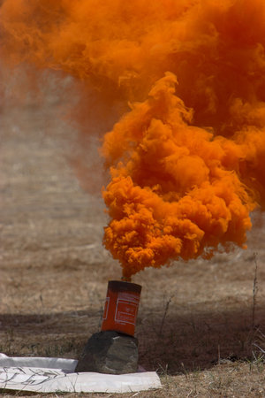 Orange smoke granade to indeicate landing for skydivers