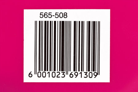 Used barcode on a pink background with numbersの写真素材