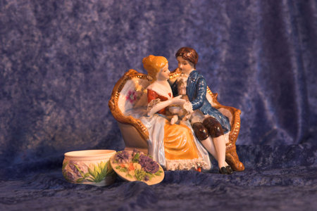 Antique ornament with two lovers holding handsの写真素材