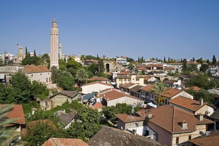rooftops of old town with covered yivli minare, antalya, turkeyの写真素材