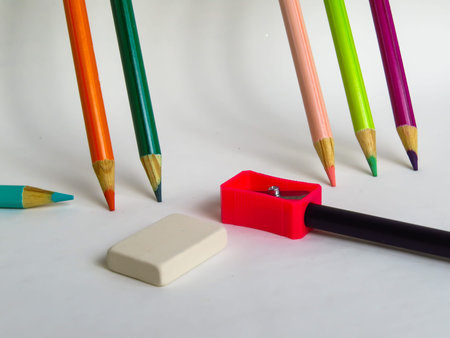 colored pencils, eraser and pencil sharpenerの写真素材