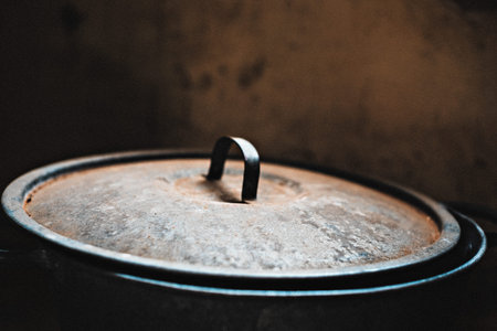 Vintage metal pot lid. Defocused background. Close up. Added noise.の写真素材