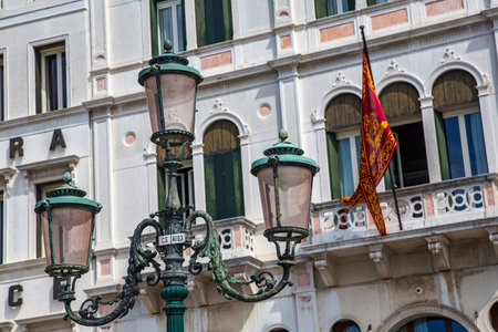 Detail shot, historical street lamp in front of facade in Venice, Italy