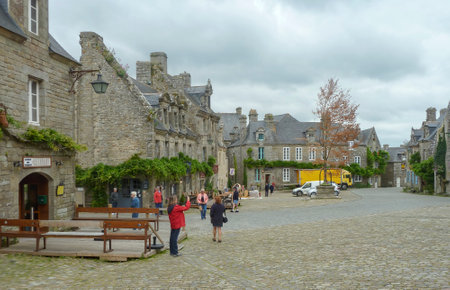 Tourist crowd of the small Breton town of Locronan, Franceのeditorial素材