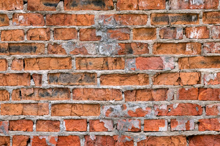 Old Red Brick Wall with Damaged Front Side as Industrial Backgroundの写真素材